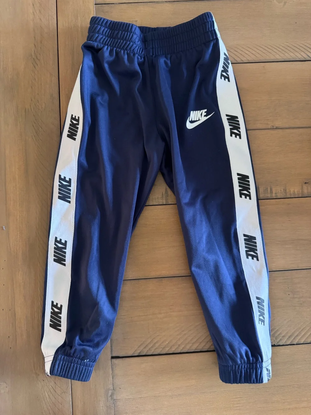 Nike Kids Navy Track Joggers with White Logo Tape